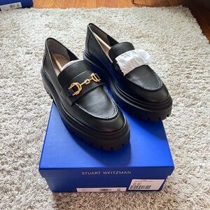 Stuart Weitzman Owen Black Loafers with Gold Chain Detail